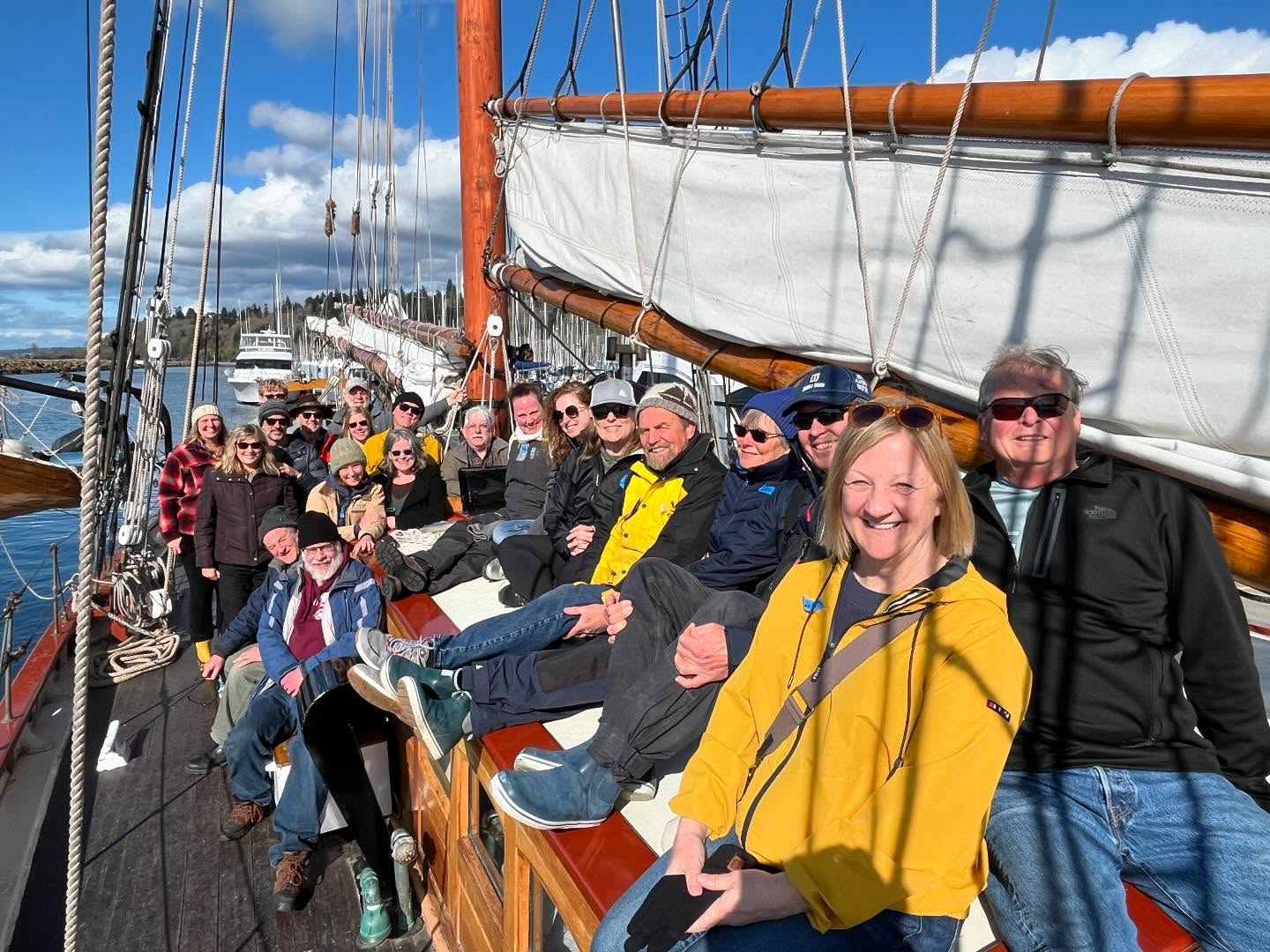 Sound Experience supporters gather on deck for a photo as the ship is underway.